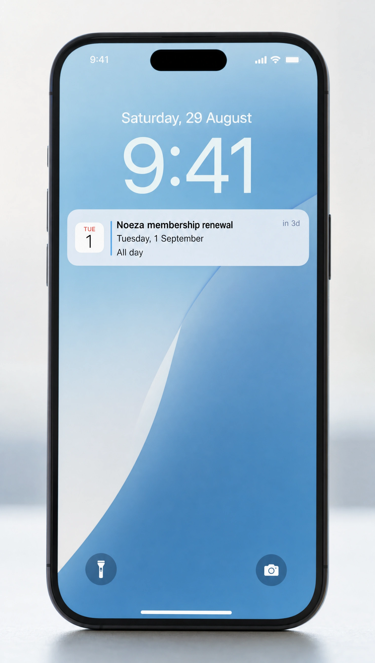 A phone lock screen showing a Noeza reminder notification ahead of the date